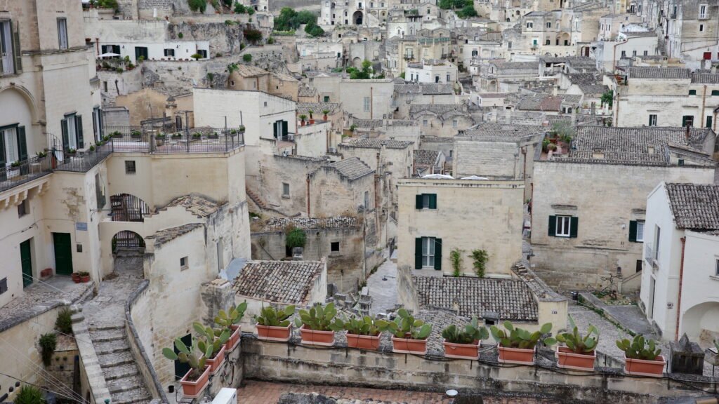 Wabi-sabi travel photography with a panoramic image of the labyrinth of tightly packed old weathered stone buildings.